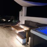 Luxury rooftop terrace with jacuzzi and lounge seating at Rustic House Embonas Rhodes